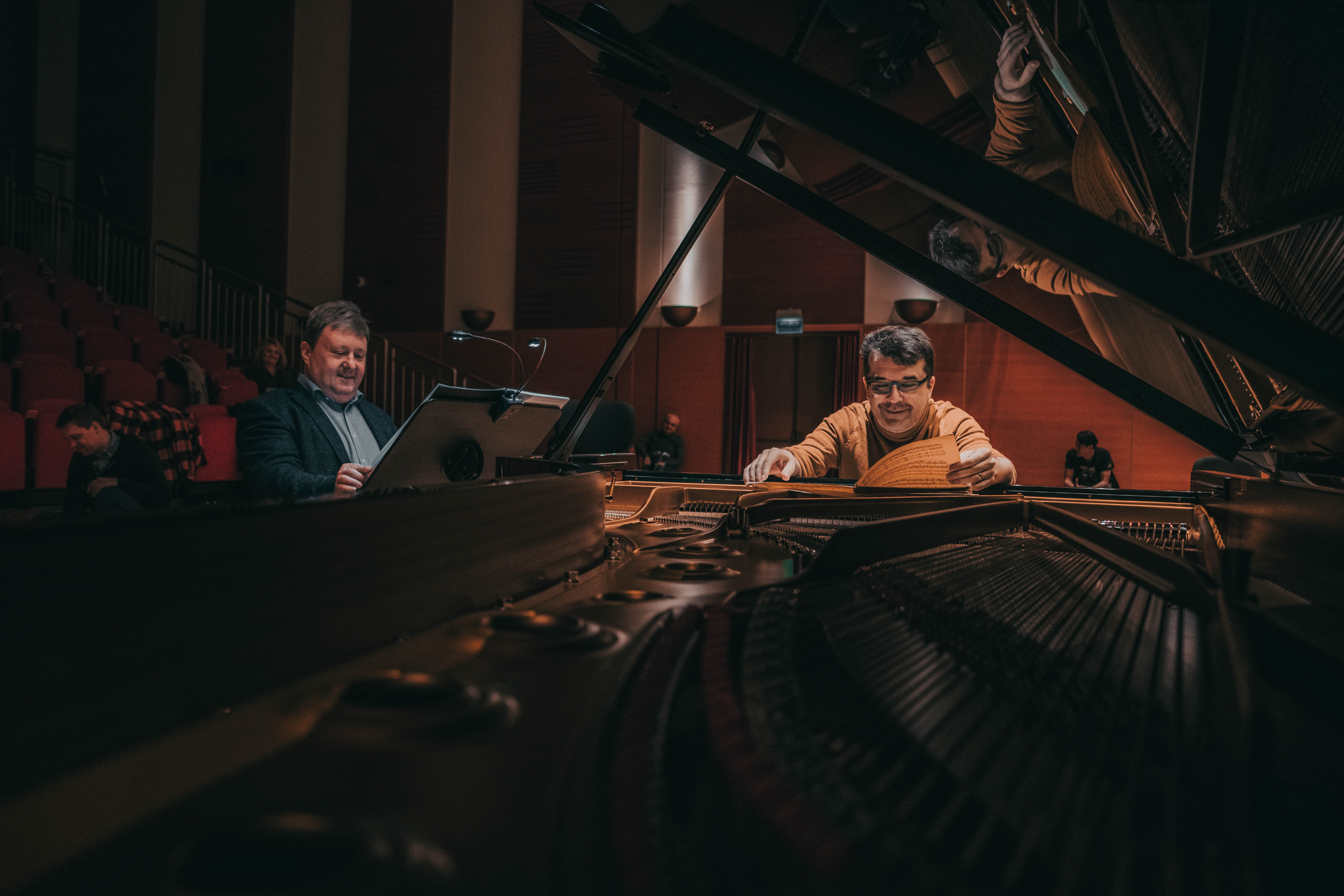 Two musicians at the grand piano during rehearsal